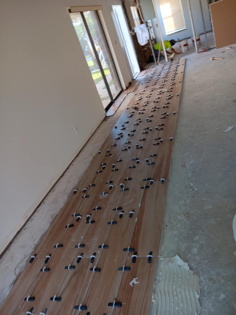 Wood-look plank tile installed with leveling spacers