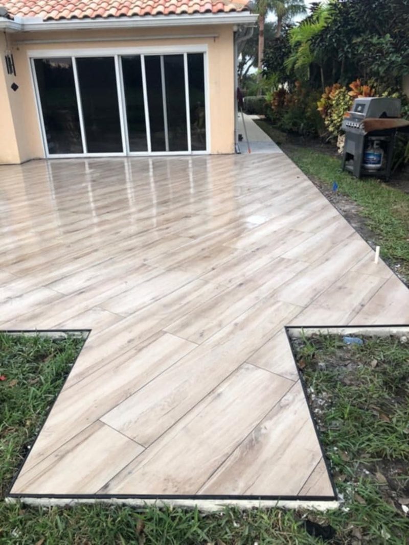 Wood-look porcelain plank tile installed on a patio