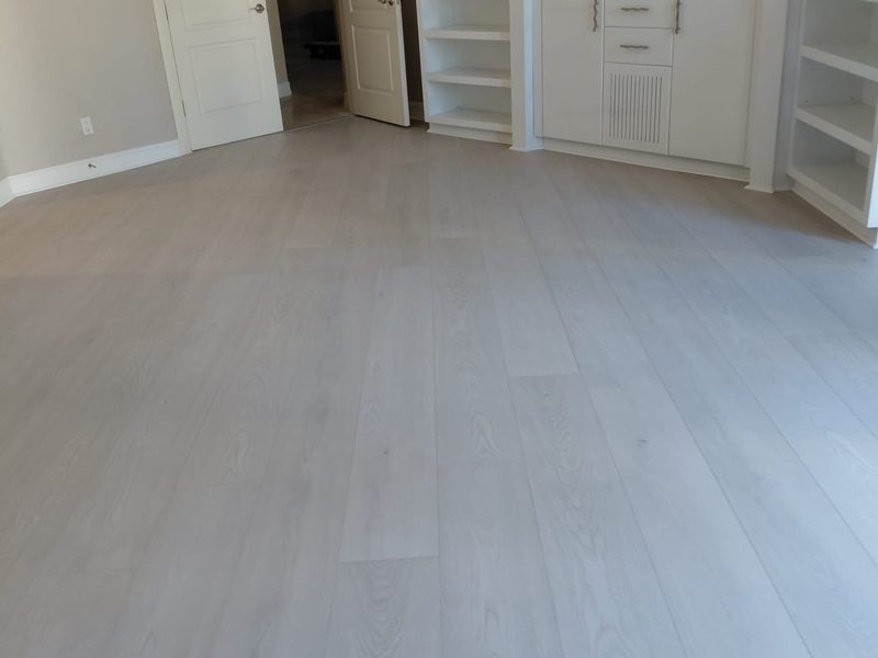Light wide-plank flooring installed in a Palm Beach County home