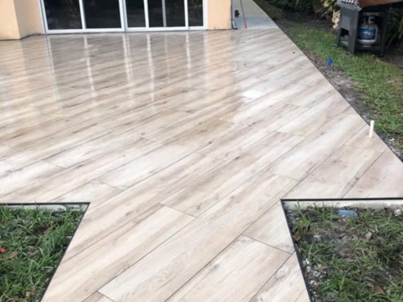 Wood-look porcelain plank tile installed on a patio